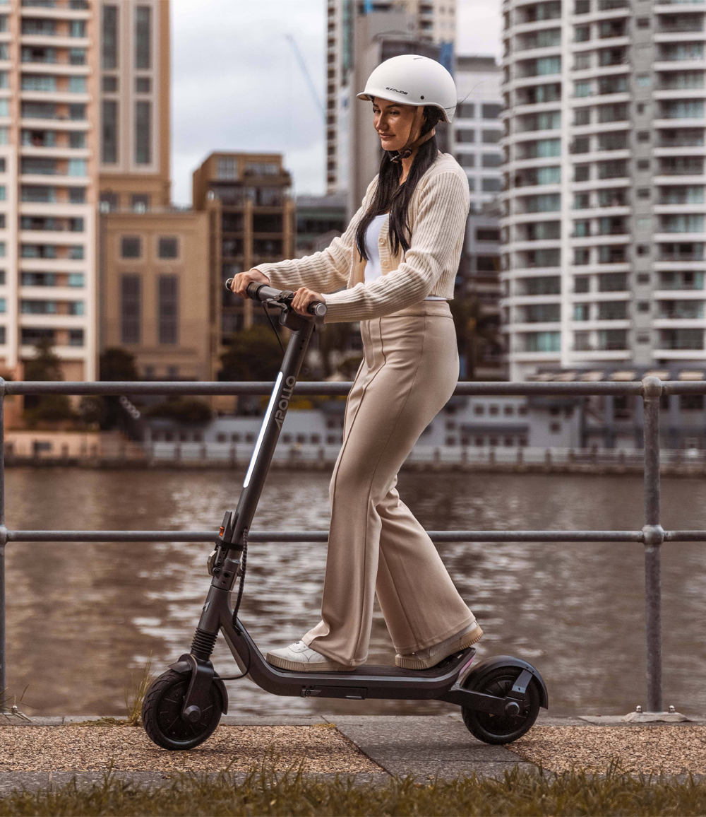 Apollo Go 2024 electric scooter with cityscape background, ideal for urban commuting.