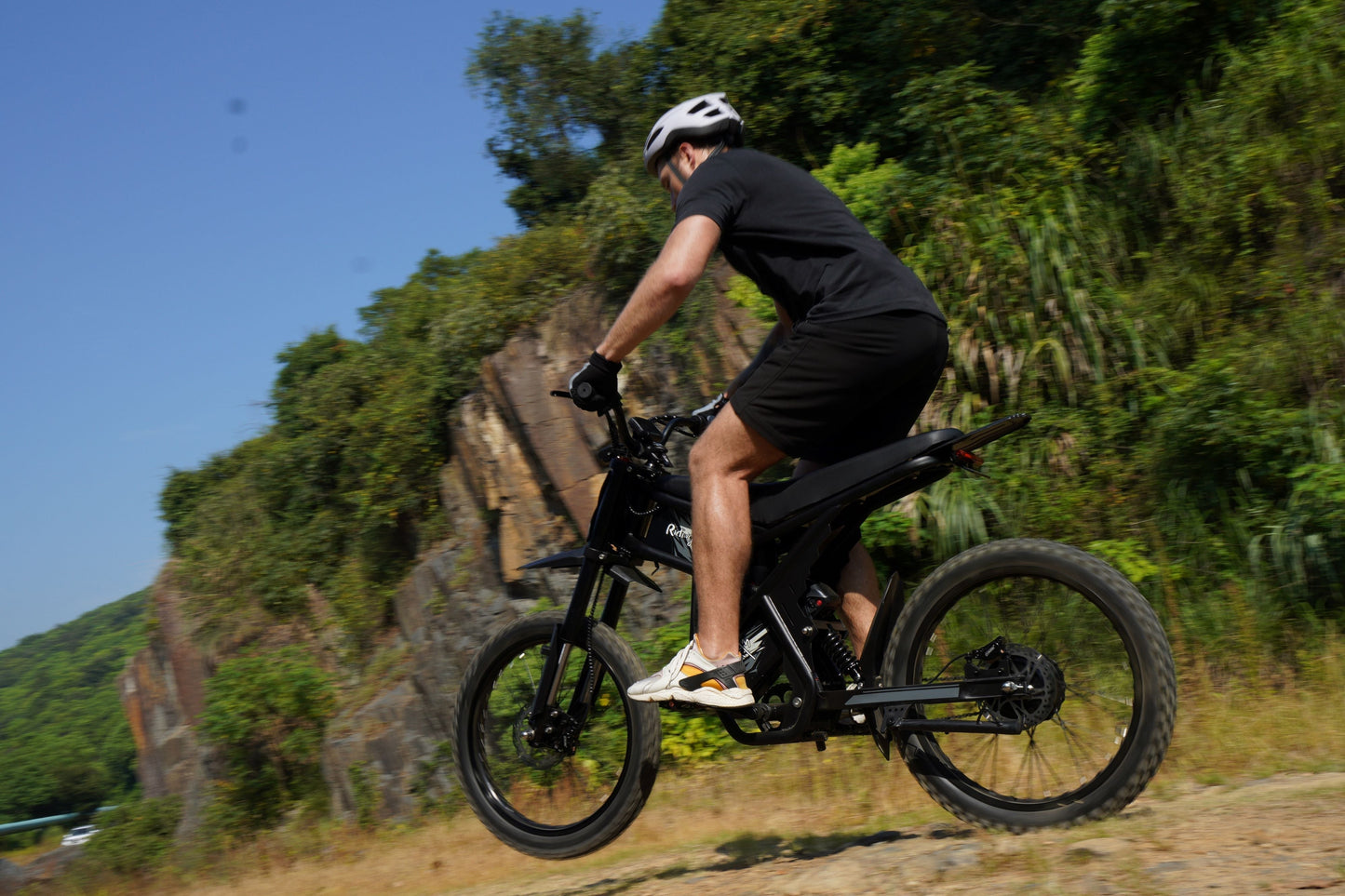 Riding Times GT73 Electric Motorbike on an off-road trail.