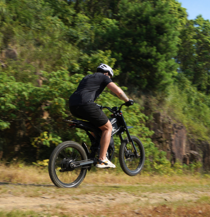 Riding Times GT73 Electric Motorbike on off-road terrain with rider in action.