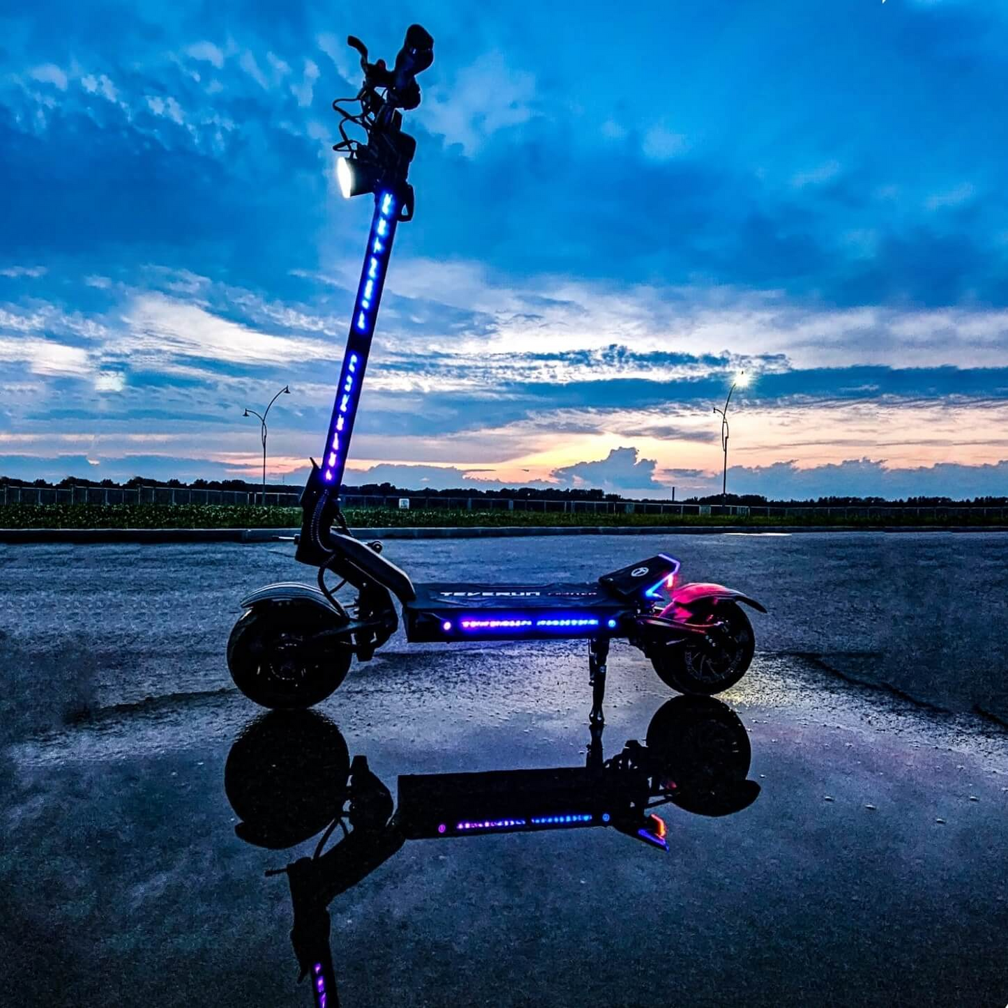 Teverun Fighter 11+ electric scooter with 4-piston brakes, 4G GPS, hydraulic suspension, and RGB lighting