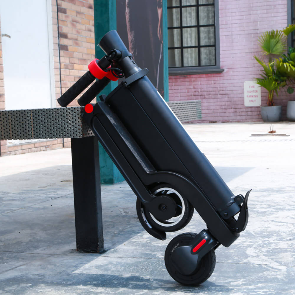 Compact EZWheel X6 electric scooter with foldable design and removable battery.