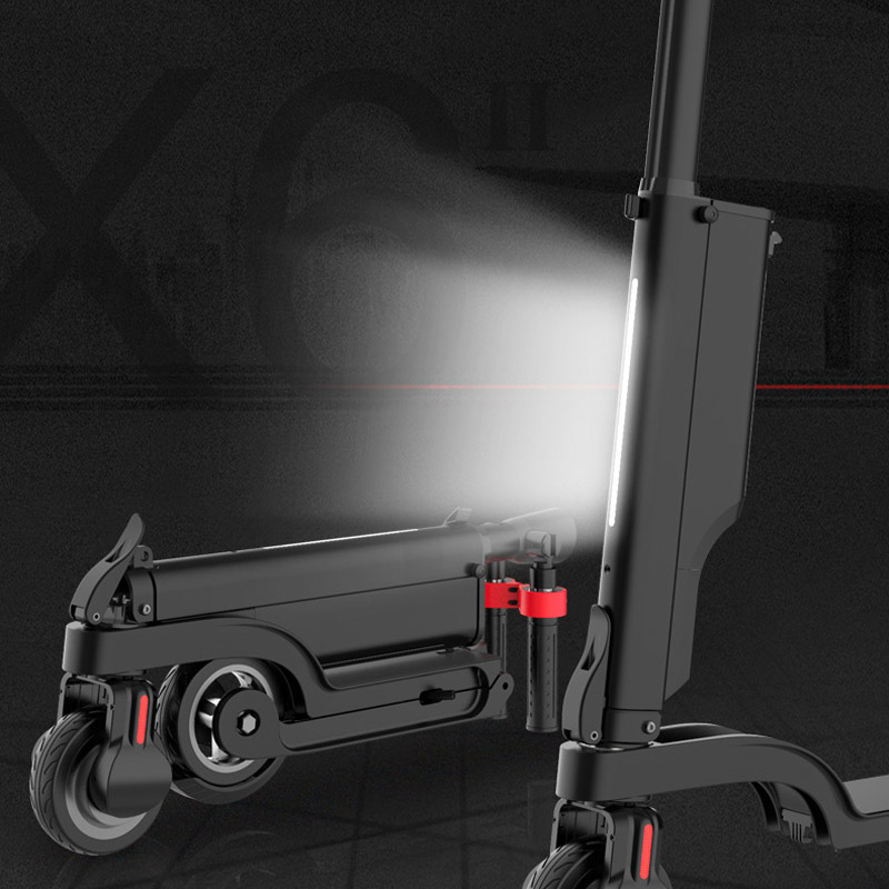 Compact EZWheel X6 electric scooter with foldable design and removable battery.